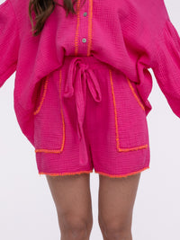 Musselin-Shorts „Stitches" in Rosa/Orange